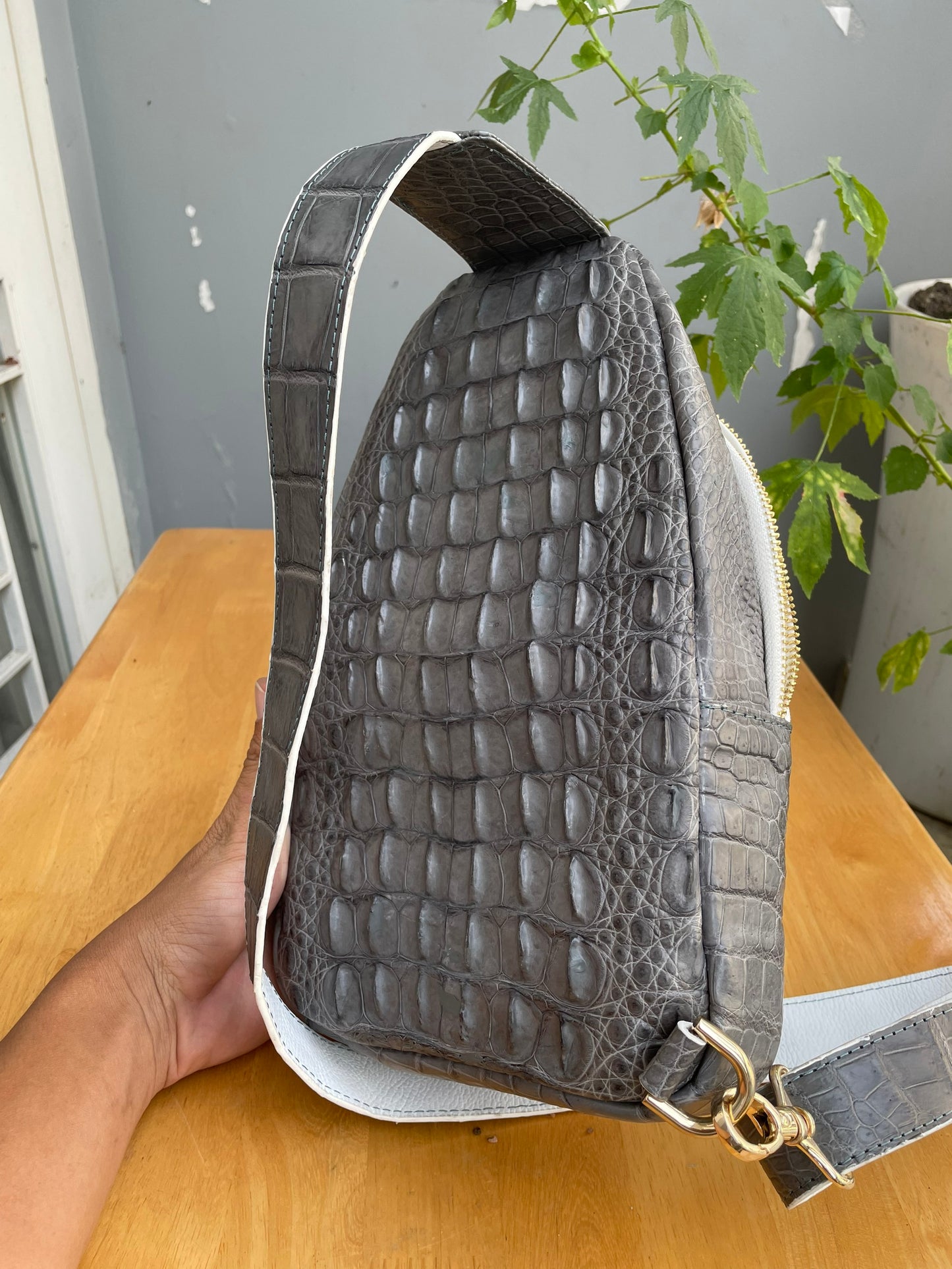 Gray alligator leather sling bag