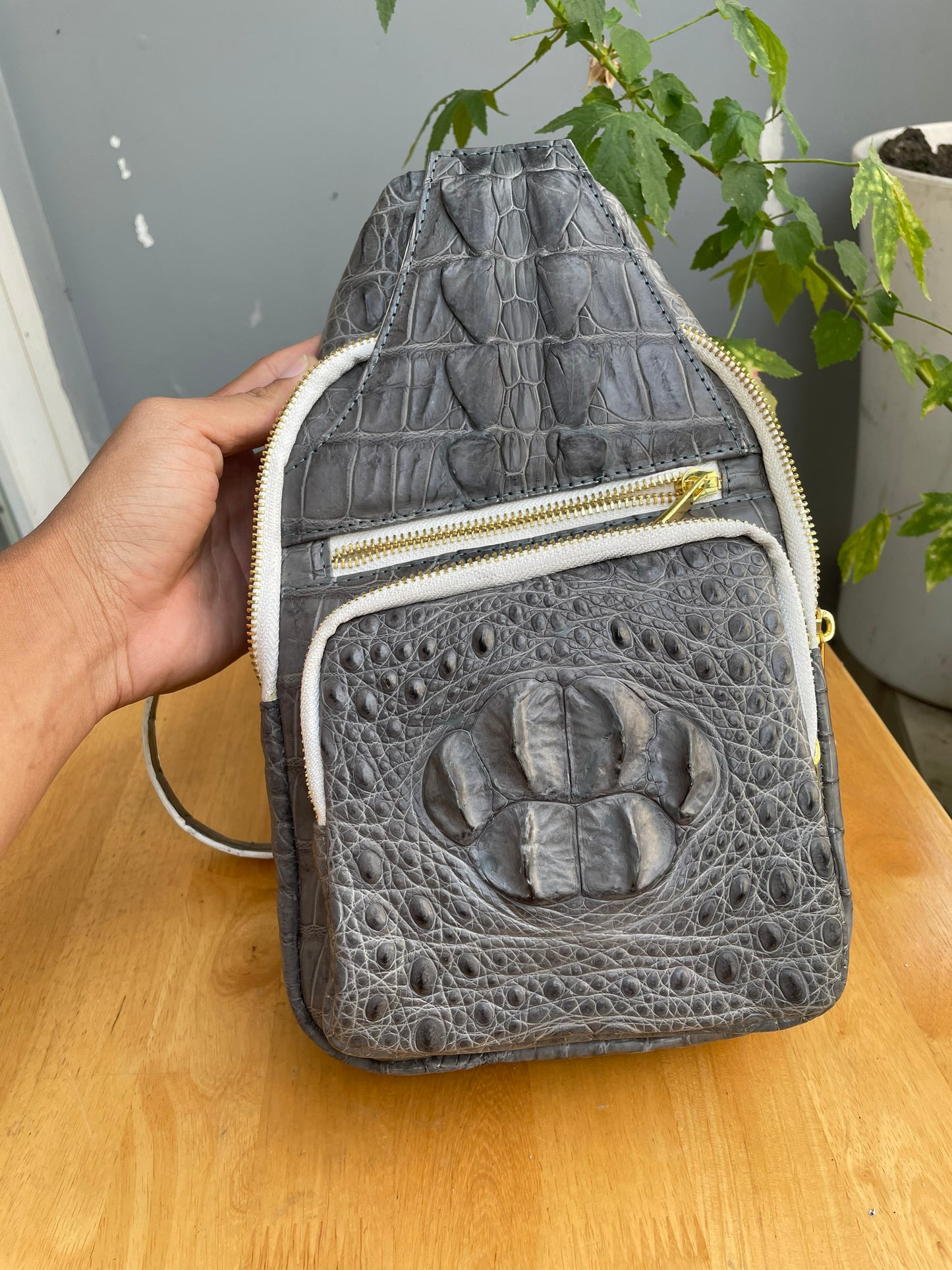 Gray alligator leather sling bag