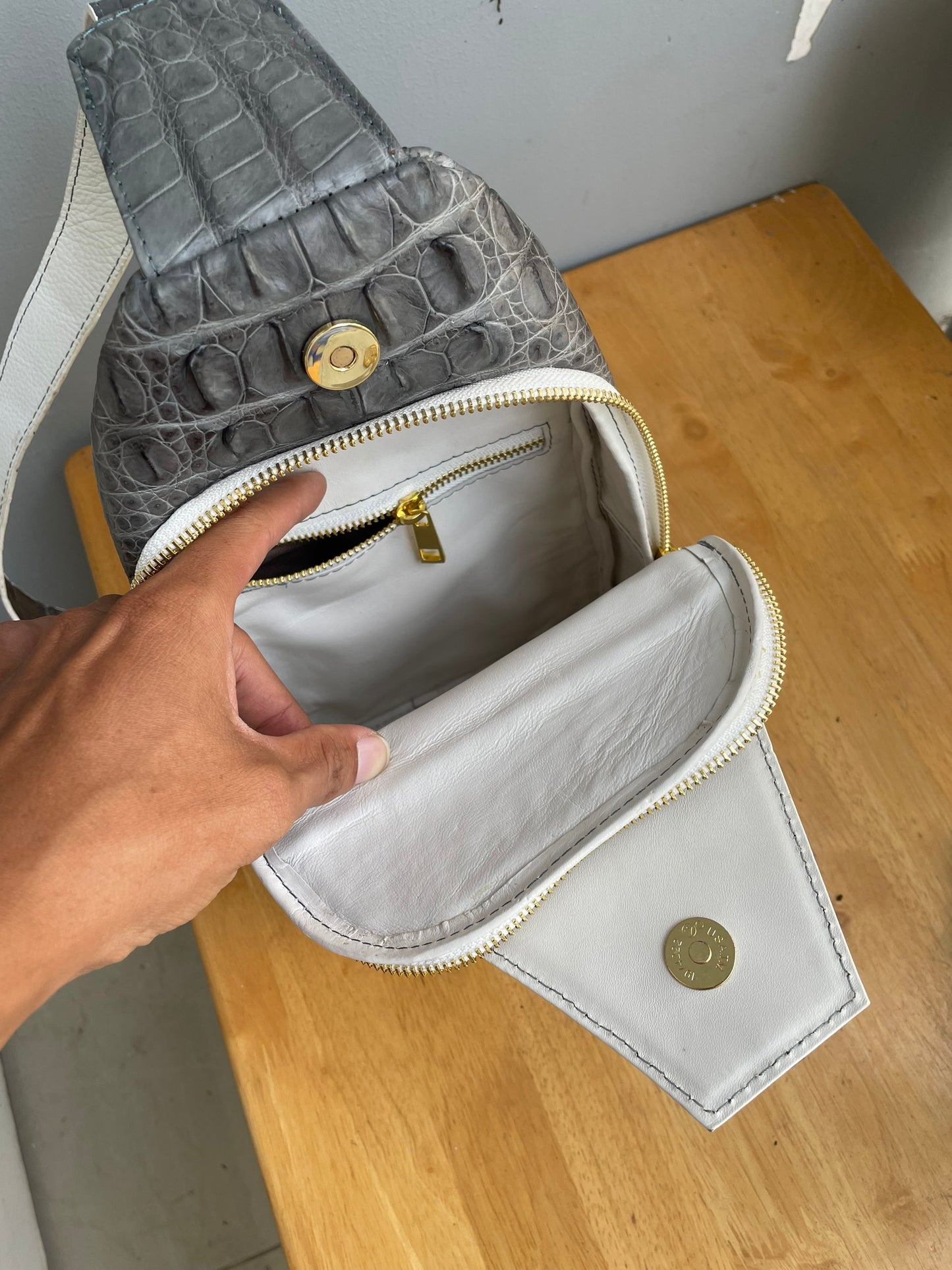 Gray alligator leather sling bag